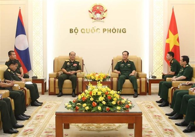 越南国防部副部长武海产上将会见老挝人民军后勤总局主任坎佩·西索尼 hinh anh 1