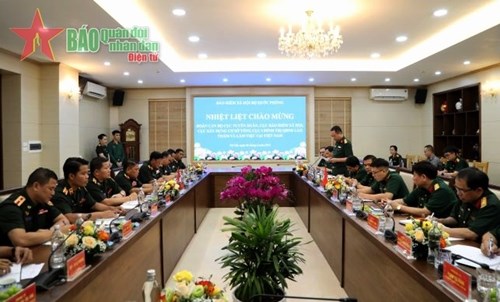 越南人民军与老挝人民军加强宣训和社保方面的合作 hinh anh 1