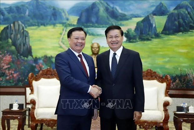 老挝人民革命党中央总书记、国家主席通伦高度评价河内与万象合作成果 hinh anh 1