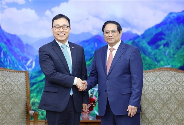 越南政府总理范明政会见韩国和老挝驻越大使 hinh anh 1