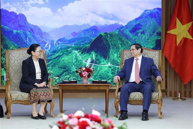 越南政府总理范明政会见韩国和老挝驻越大使 hinh anh 2