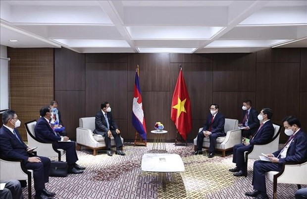 越南政府总理范明政分别会见埔寨首相、新加坡总理和马来西亚总理 hinh anh 1