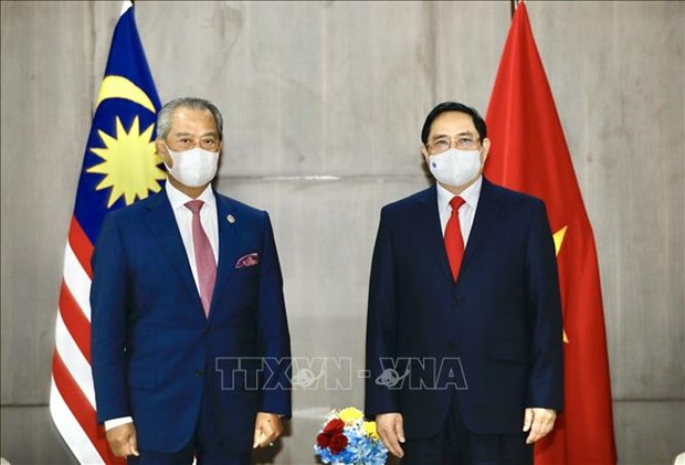 越南政府总理范明政分别会见埔寨首相、新加坡总理和马来西亚总理 hinh anh 3