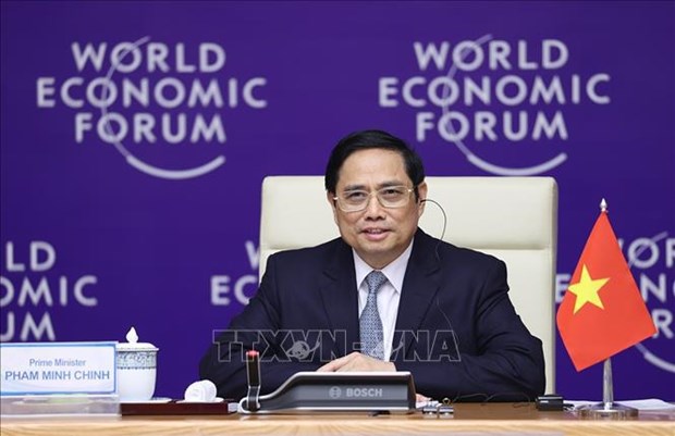 政府总理范明政共同主持第一次越南与世界经济论坛国家战略对话 hinh anh 1